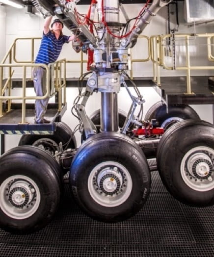 Employee working on plane wheels andbrakes